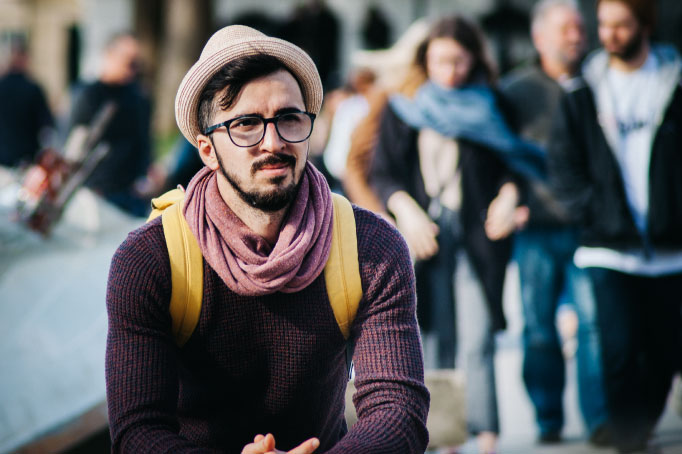 young man sitting and looking worried