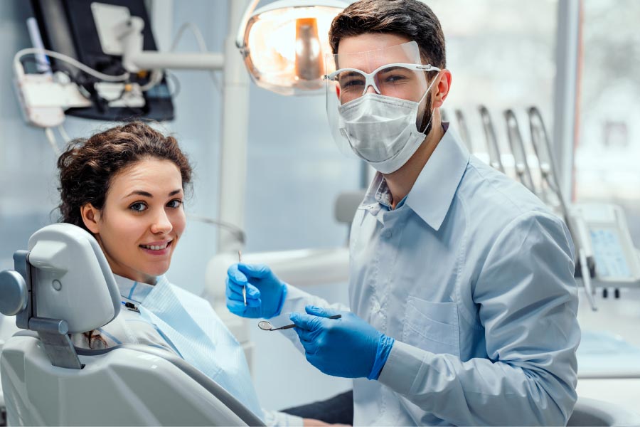 young girl in the dentist chair getting a cleaning and exam