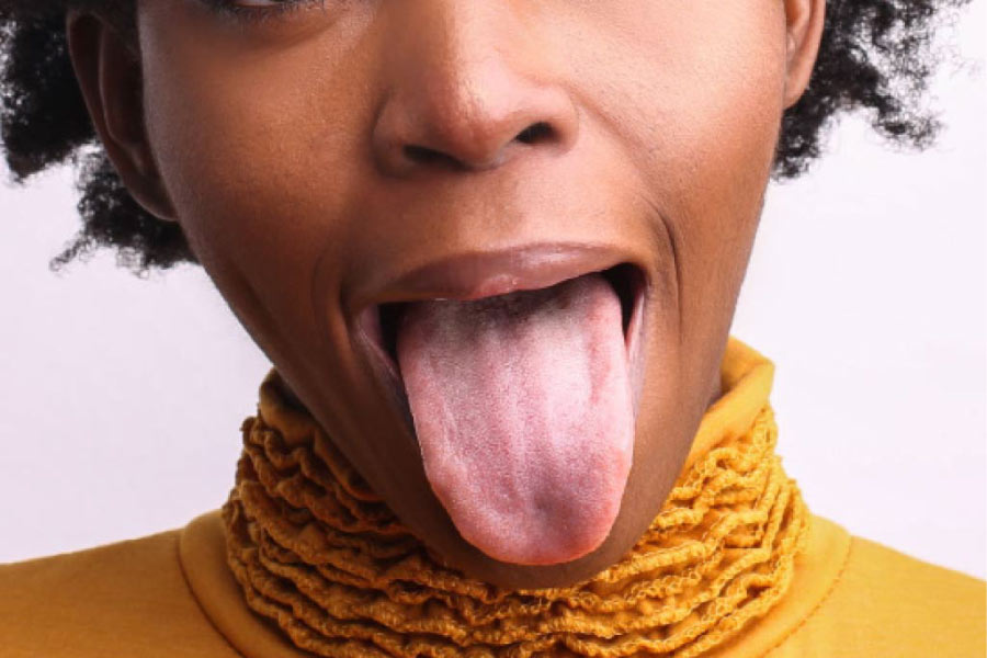 closeup of a young woman sticking out her tongue