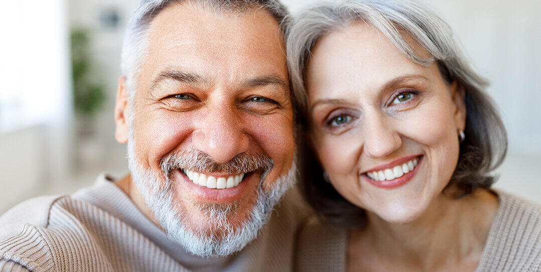 Man and woman smiling