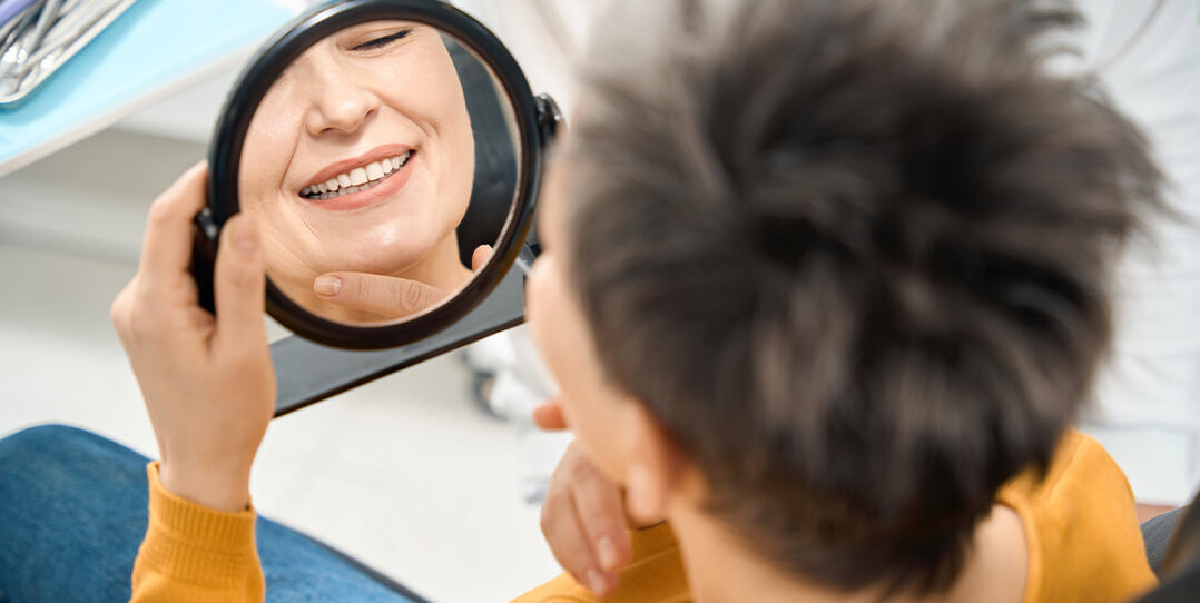 hero-tooth-colored-fillings Woman in dental chair